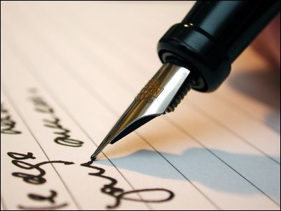 man writing a contract